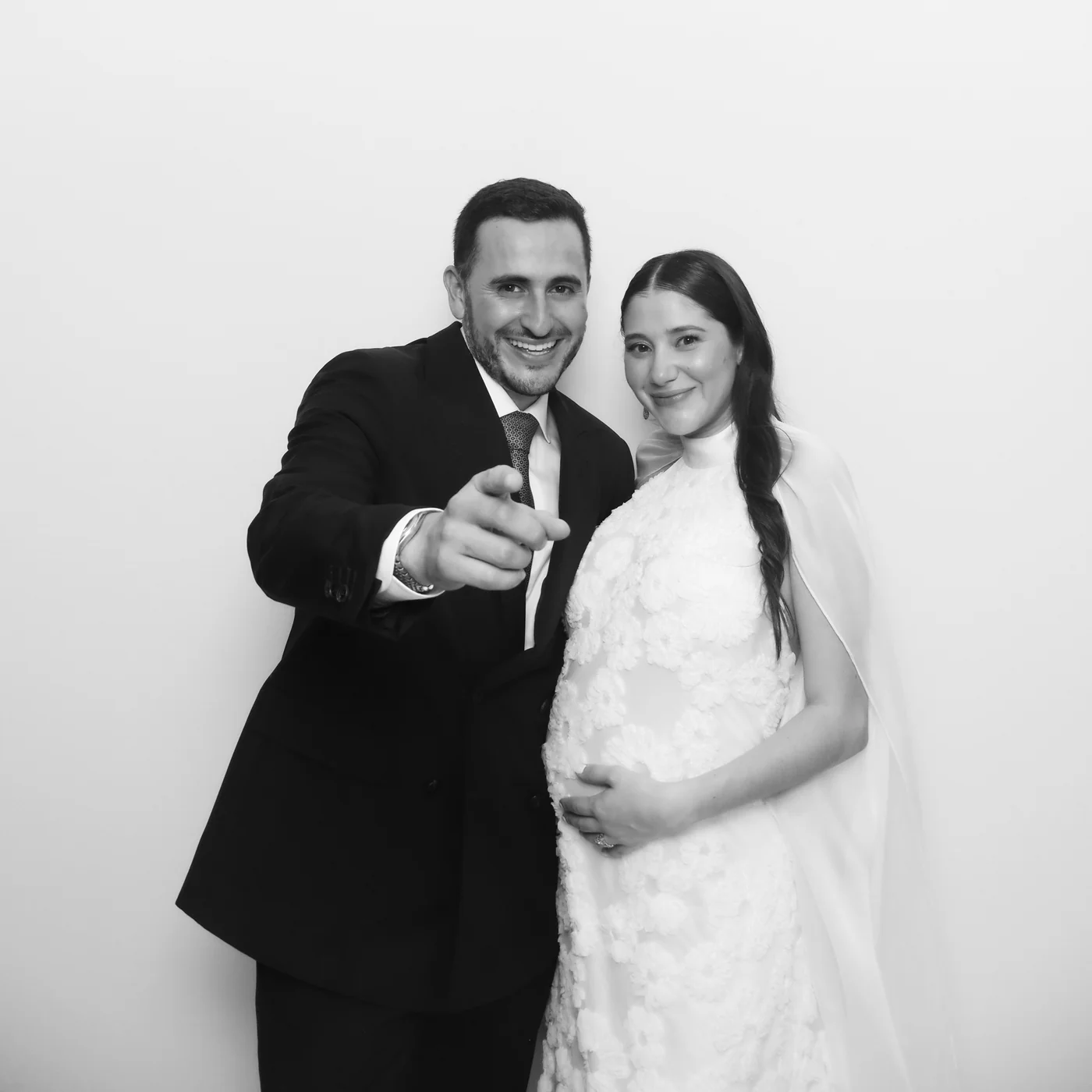 Couple smiling together in a black-and-white Glam photo booth portrait