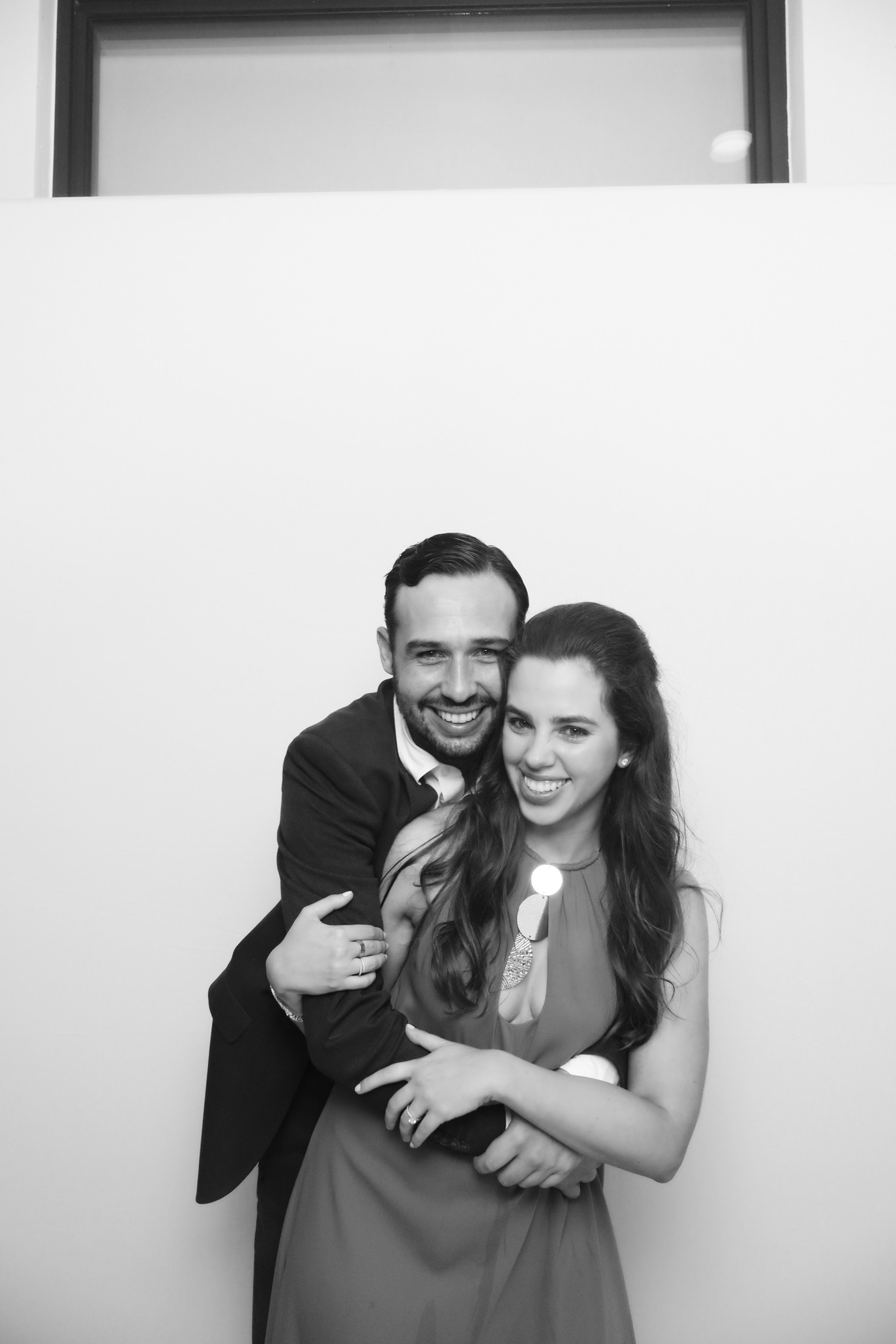 Couple together in a black-and-white Glam photo booth portrait