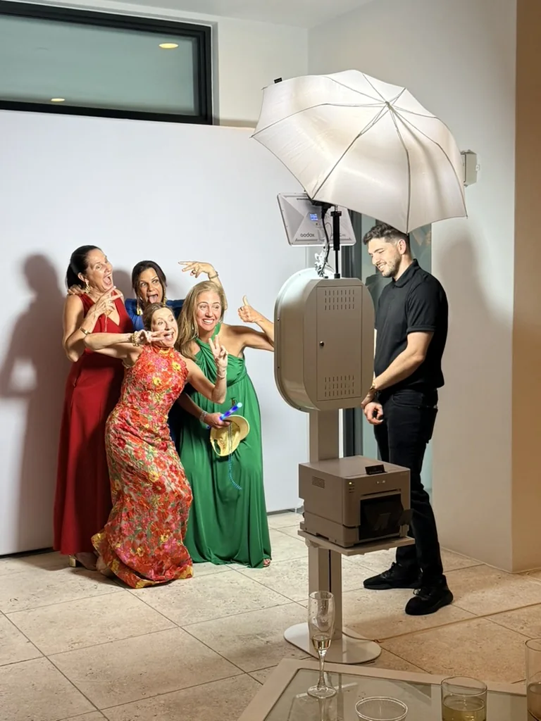 Eleganza Glam photo booth setup with attendant at Key Biscayne Yacht Club