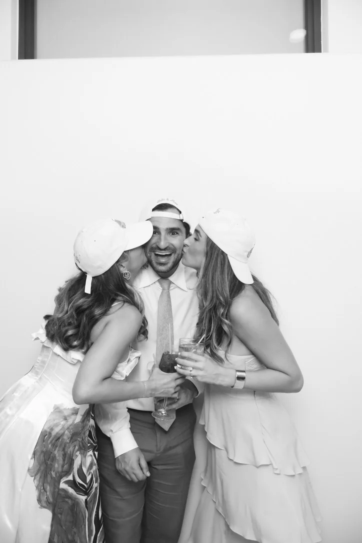 Wedding guests having fun in the Glam photo booth at Key Biscayne Yacht Club