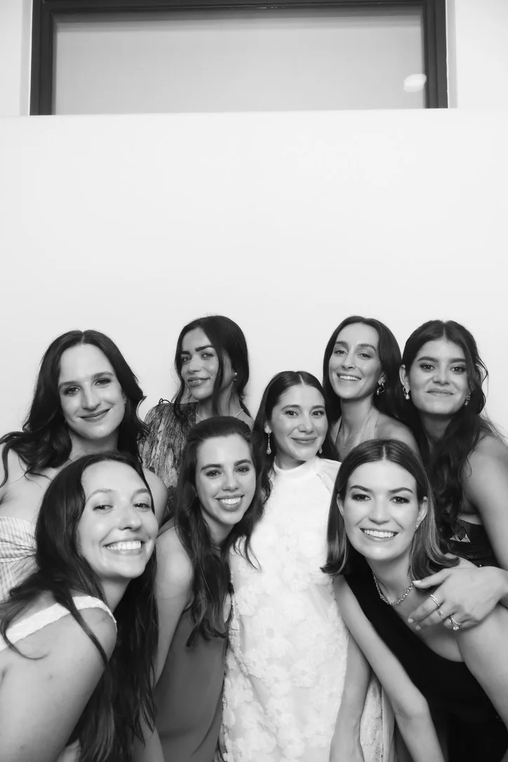 Bride and wedding party posing at the Glam photo booth at Key Biscayne Yacht Club