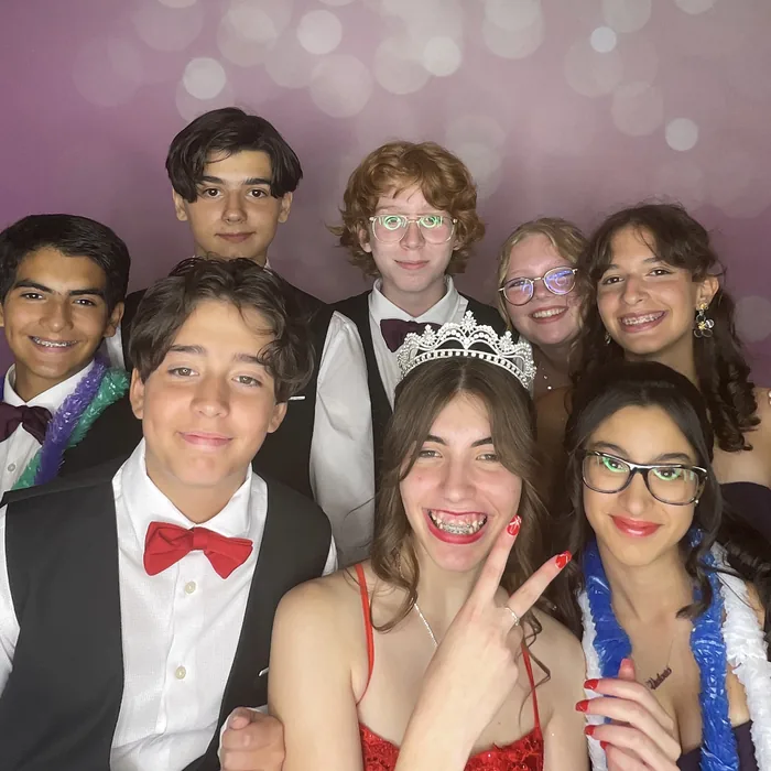 Quinceañera court gathered for a group photo at a Miami celebration