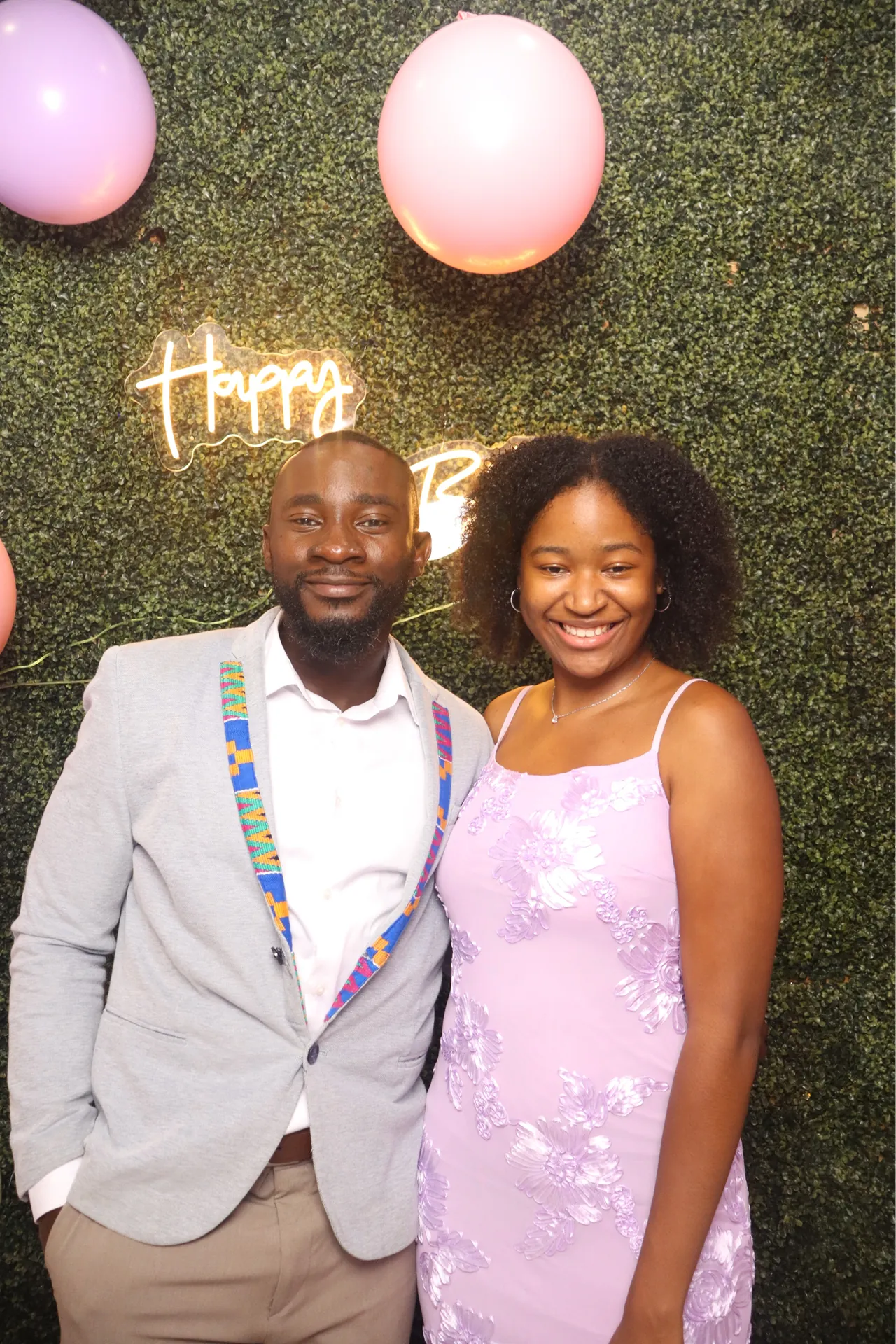 Two guests smile at the DSLR photo booth during a birthday party in Sunrise, Florida