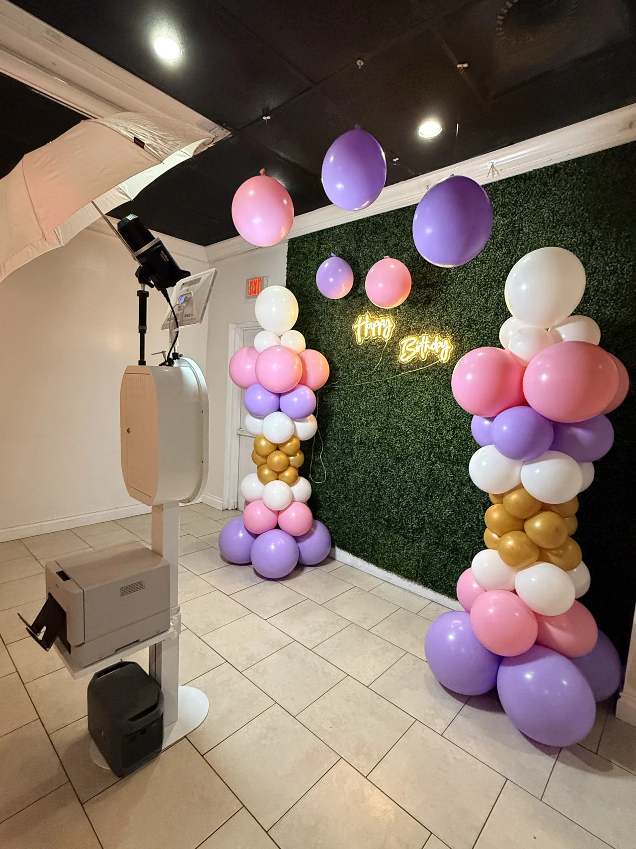 DSLR photo booth with studio lighting and on-site printer set up for a Sunrise birthday party