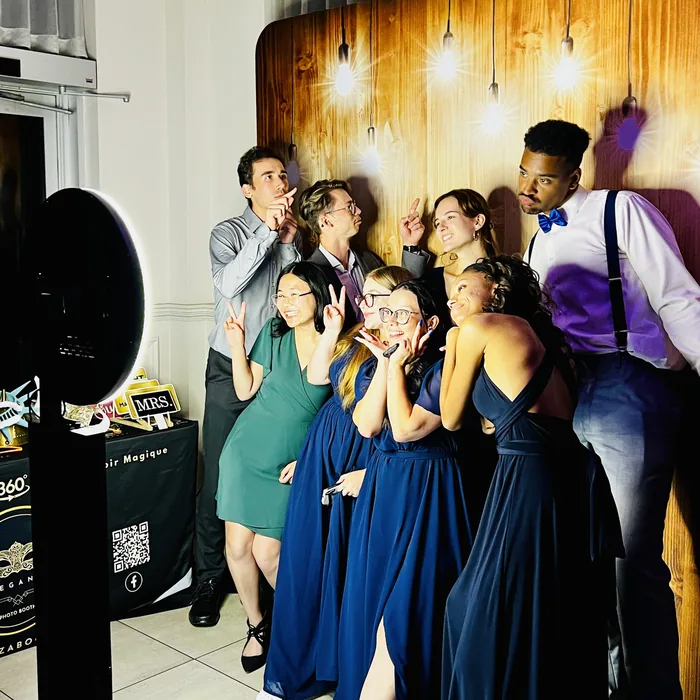 Guest using a self-service photo booth at a wedding